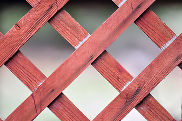 Image showing red lattice fence detail