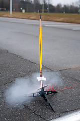 Image showing model toy rocket lift off