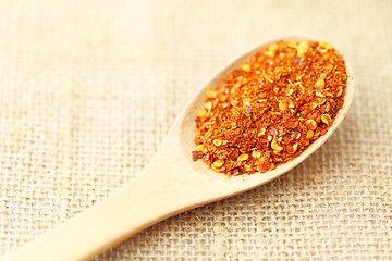 Image showing Chili powder on wooden spoon