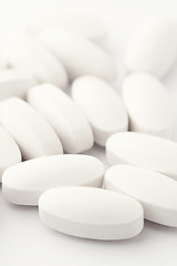 Image showing White pills on white background