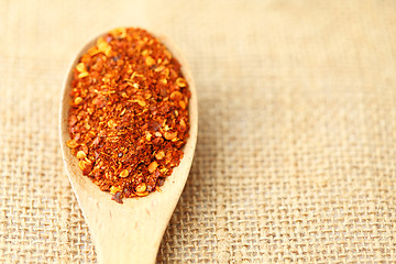 Image showing Chili powder on wooden spoon