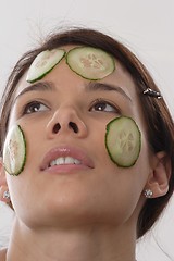 Image showing Woman with cucumber slices