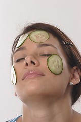 Image showing Woman with cucumber slices