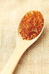 Image showing Chili powder on wooden spoon