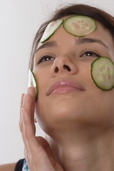 Image showing Woman with cucumber slices