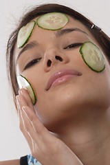 Image showing Woman with cucumber slices