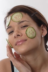 Image showing Woman with cucumber slices