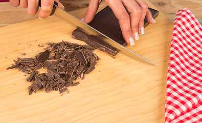 Image showing Chopping dark chocolate