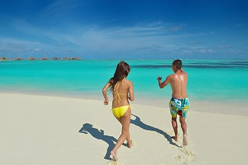 Image showing happy young  couple enjoying summer on beach