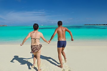 Image showing happy young  couple enjoying summer on beach