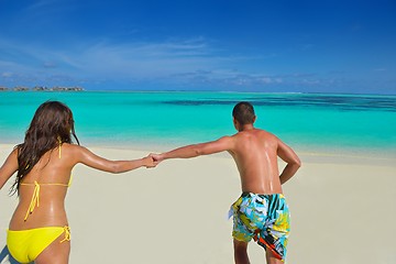 Image showing happy young  couple enjoying summer on beach