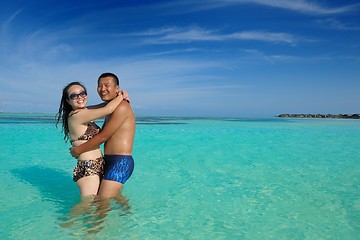 Image showing happy young  couple enjoying summer on beach