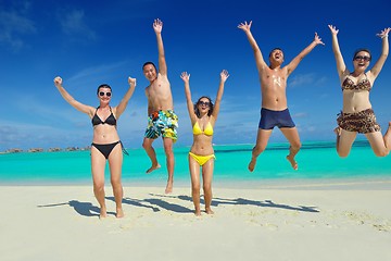 Image showing group of happy young people have fun on bach