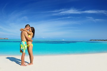 Image showing happy young  couple enjoying summer on beach