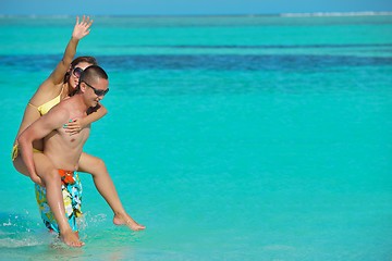 Image showing happy young  couple enjoying summer on beach