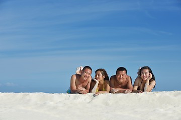 Image showing group of happy young people have fun on bach