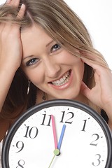 Image showing woman with clock