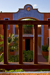 Image showing  bush  window and red house  