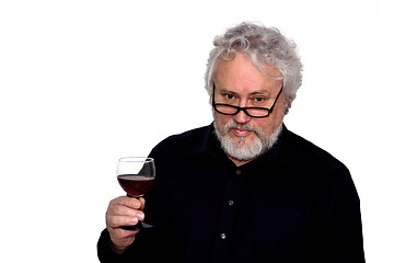 Image showing A senior and red wine