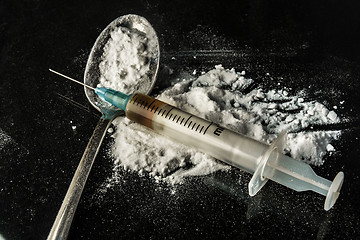 Image showing Drug syringe and cooked heroin on spoon