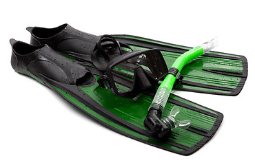 Image showing Mask, snorkel and flippers with water drops. Diving gear on whit