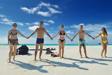 Image showing group of happy young people have fun on bach