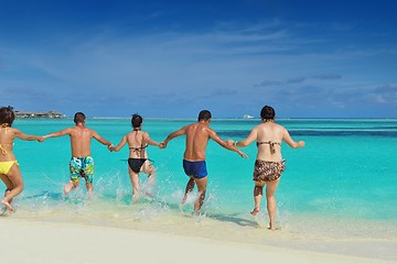 Image showing group of happy young people have fun on bach