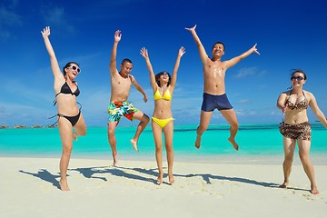 Image showing group of happy young people have fun on bach