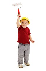 Image showing Little boy painting with paint roller