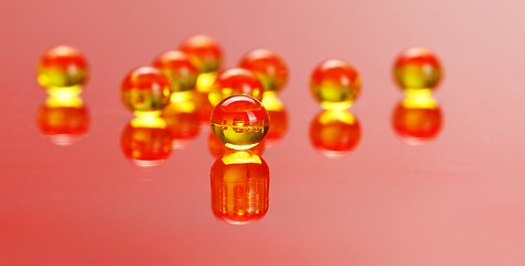 Image showing Macro of E vitamine pills on red