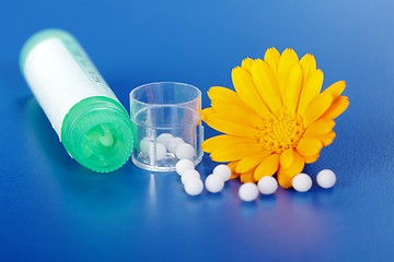 Image showing Calendula Officinalis and homeopathic pills