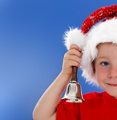 Image showing Half face of bell ringing little boy on blue