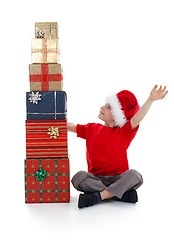 Image showing Young child rejoicing over presents