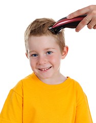 Image showing Smiling boy getting haircut