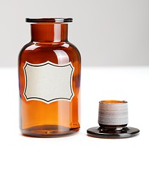 Image showing Empty, open glass chemical bottle