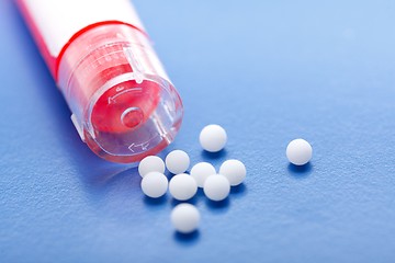 Image showing Modern homeopathic pills and container