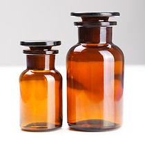 Image showing Pair of empty chemical glass bottles