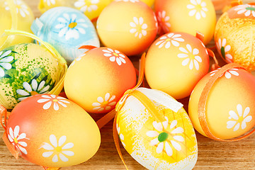Image showing Bright color easter eggs with bows