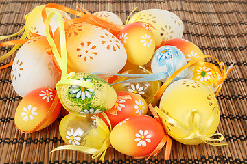 Image showing Bright color easter eggs with bows