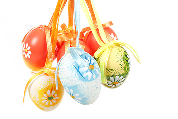 Image showing hanged bright color easter eggs with bows