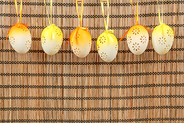 Image showing Bright color easter eggs with bows