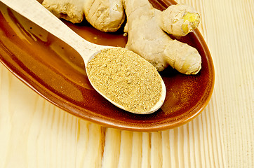 Image showing Ginger fresh and dried on a clayware