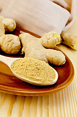 Image showing Ginger fresh and dried on a clayware with a napkin