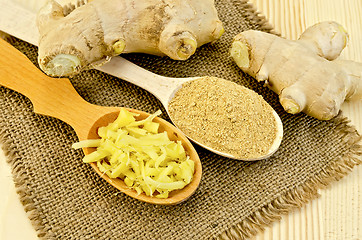 Image showing Ginger fresh and dried in wooden spoons