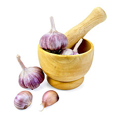 Image showing Garlic in a wooden mortar