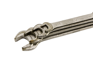 Image showing stacked set size wrench screw tools on white 