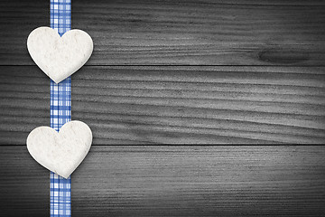 Image showing Two hearts laying on wood