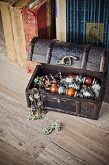 Image showing  casket with jewelry and old book on a wooden surface 