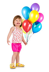 Image showing Little girl smiling with balloons.