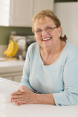 Image showing Portrait of Beautiful Senior Adult Woman in Kitchen